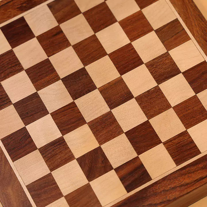 Close-up of a wooden checkered board with alternating brown and beige squares.