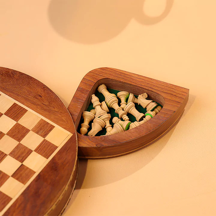 Wooden chess set with pieces and board on a beige background