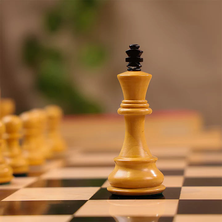 Close-up of a chess piece on a chessboard with a blurred background