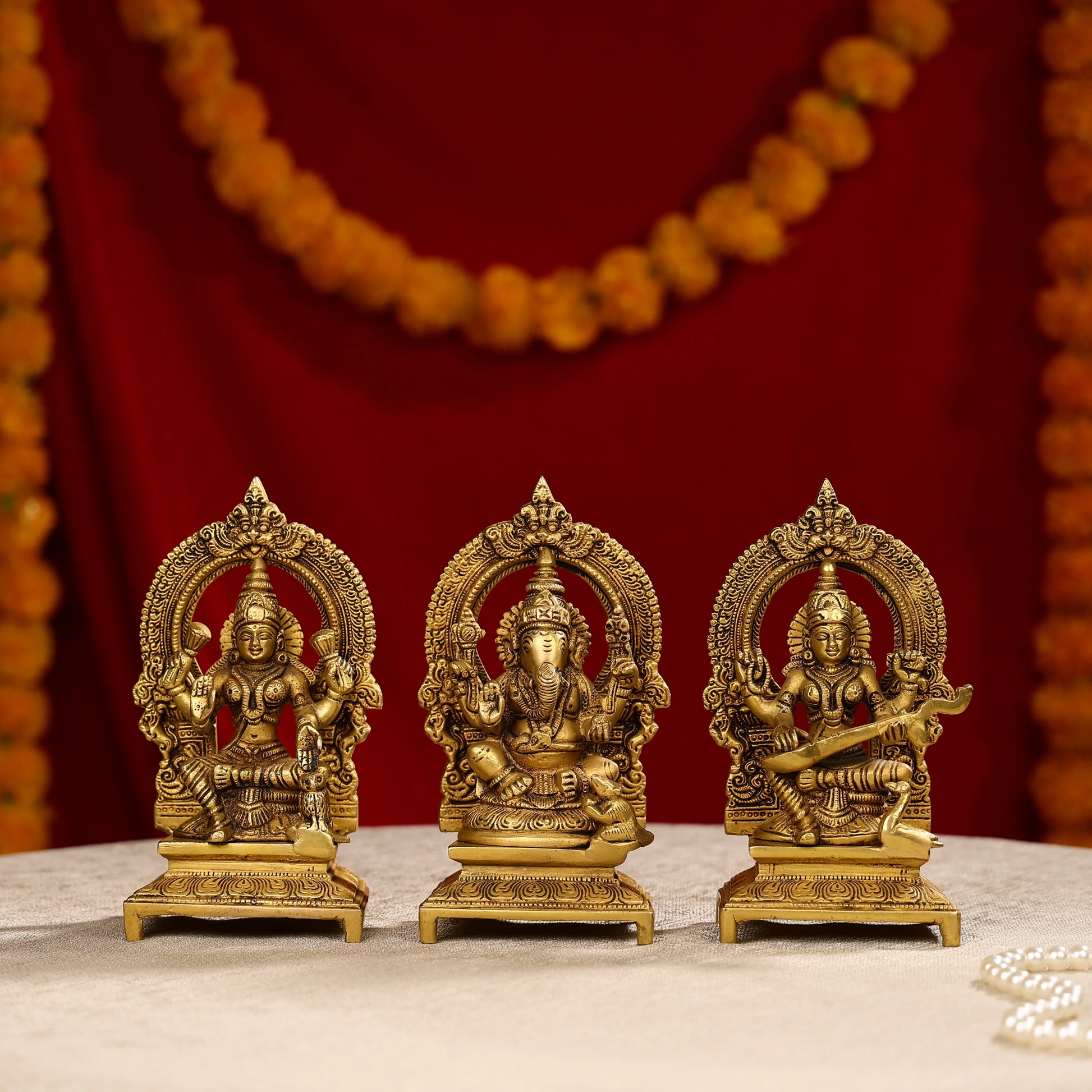 Brass Lakshmi Ganesha And Saraswati Trio Idols Seated On Throne
