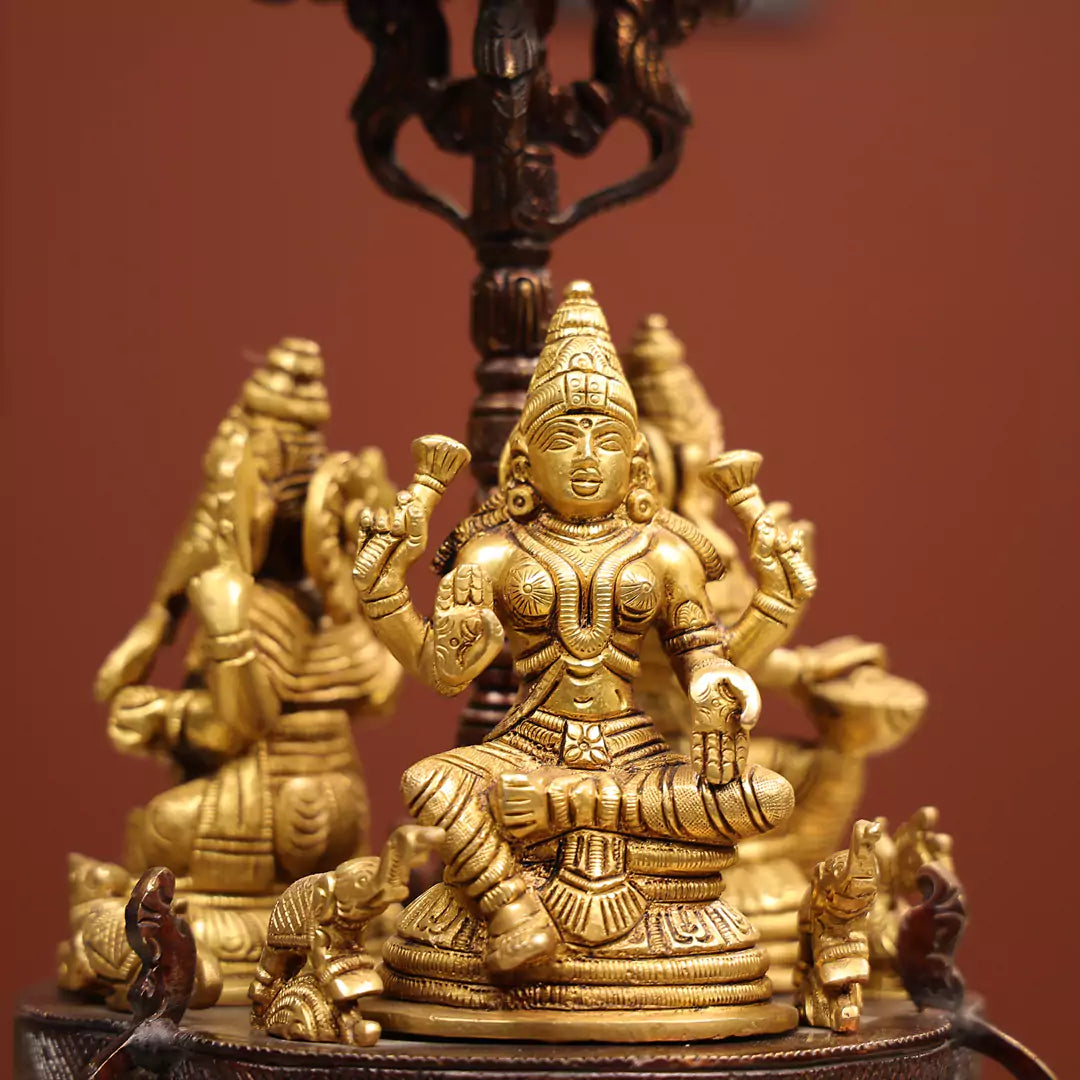 Revolving Three-Sided Idol Of Goddess Lakshmi, Goddess Saraswati And Lord Ganesh