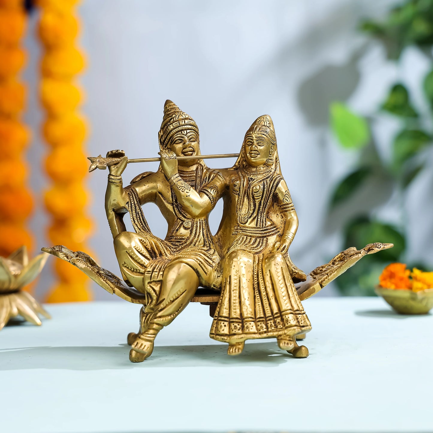 Brass Goddess Radha & Krishna Seated on Sofa 1