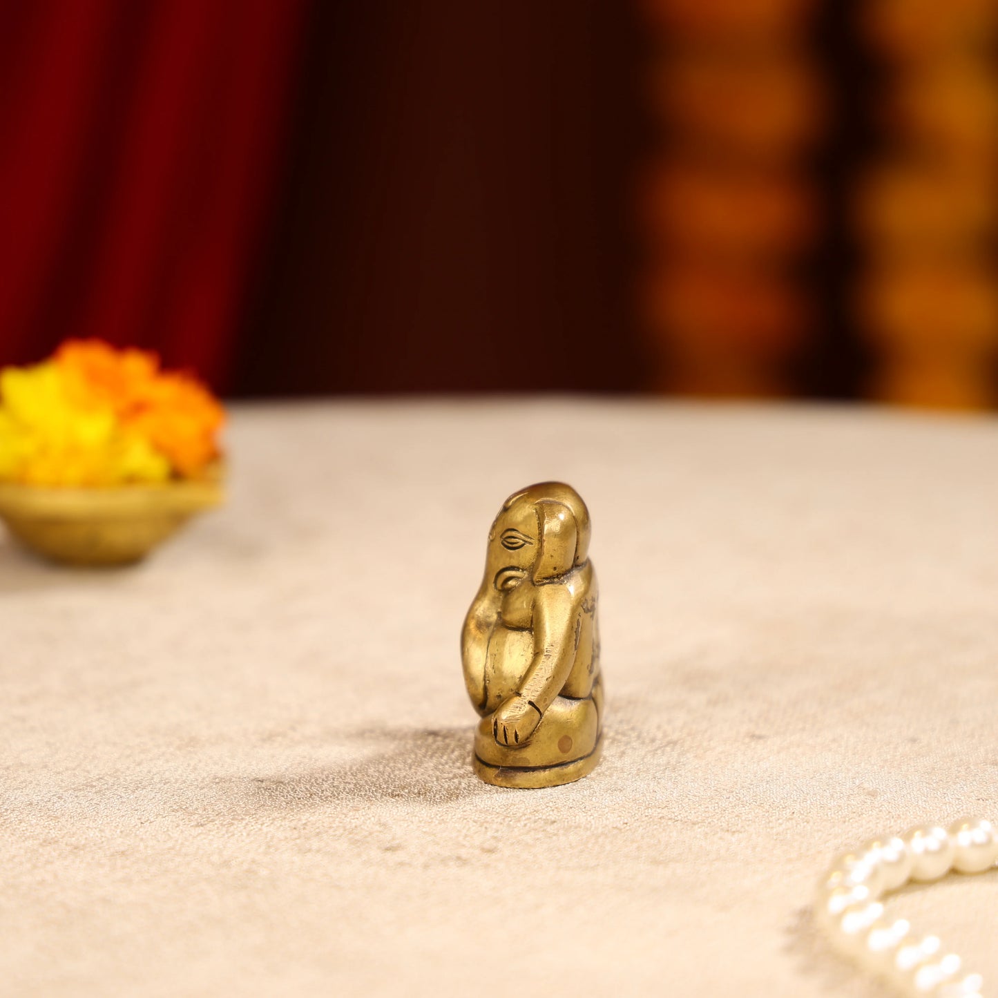 Gold Toned Lord Ganesh Brass Idol In A Sitting Posture