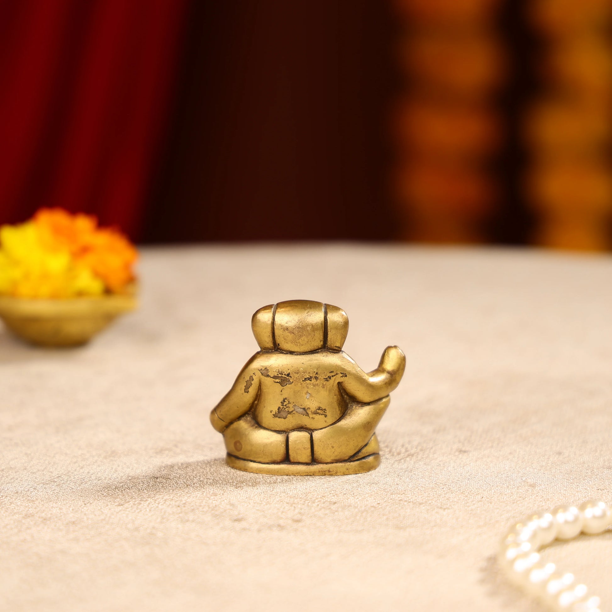 Gold Toned Lord Ganesh Brass Idol In A Sitting Posture