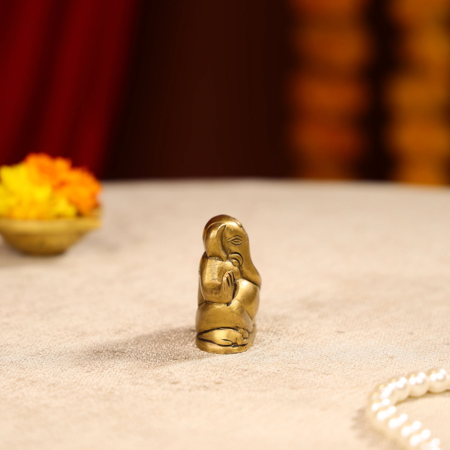 Gold Toned Lord Ganesh Brass Idol In A Sitting Posture