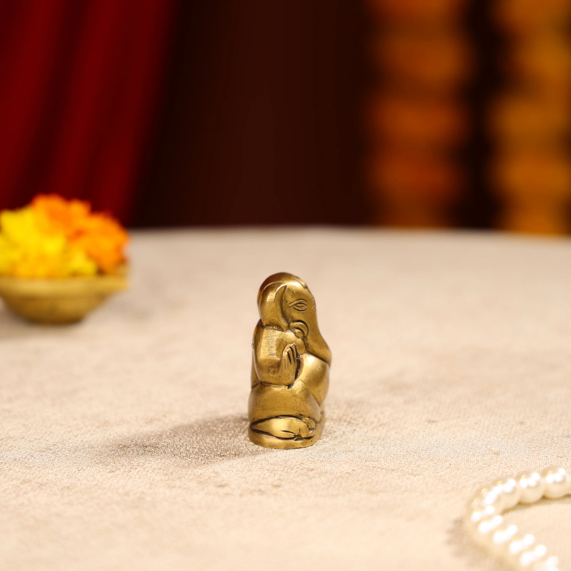 Gold Toned Lord Ganesh Brass Idol In A Sitting Posture