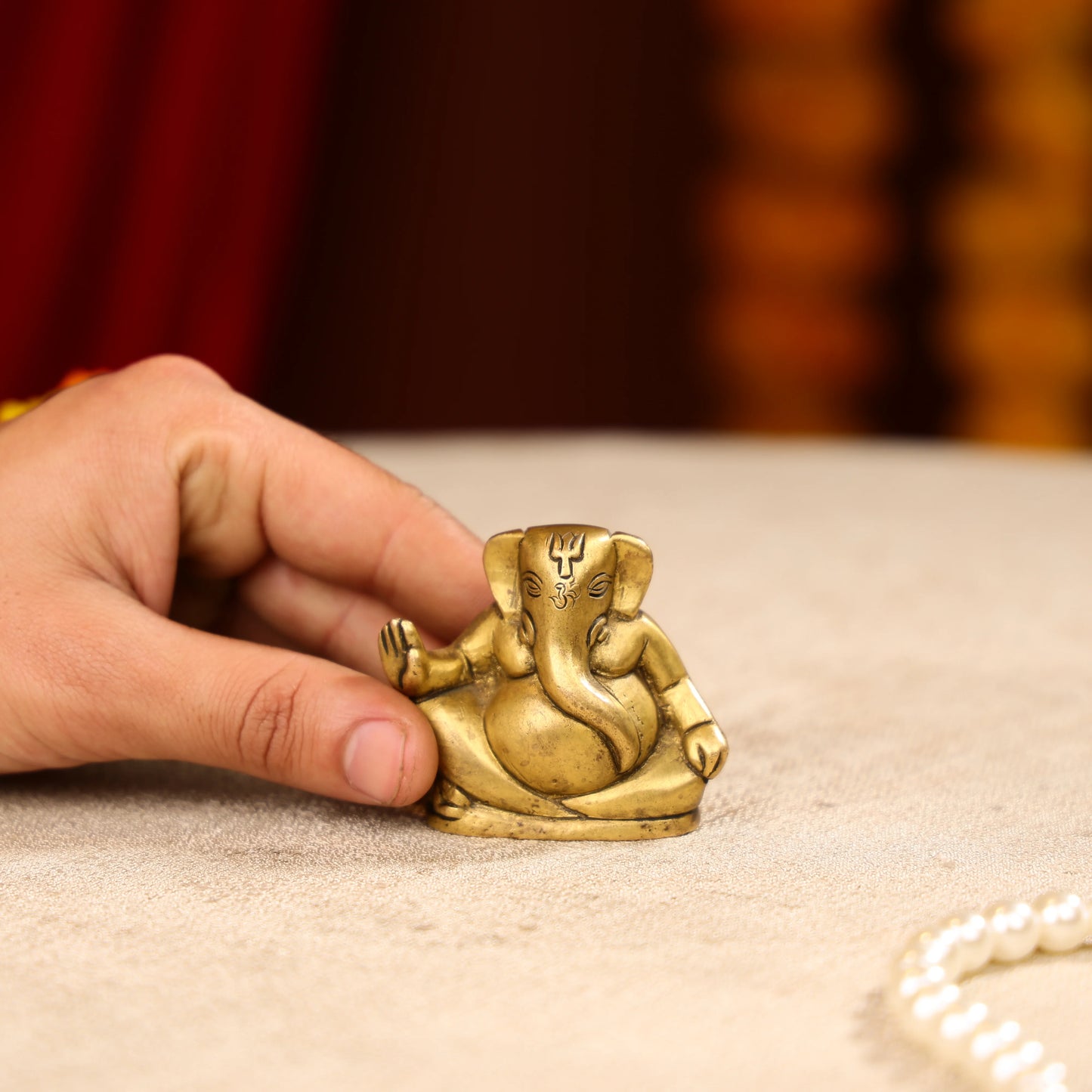 Gold Toned Lord Ganesh Brass Idol In A Sitting Posture
