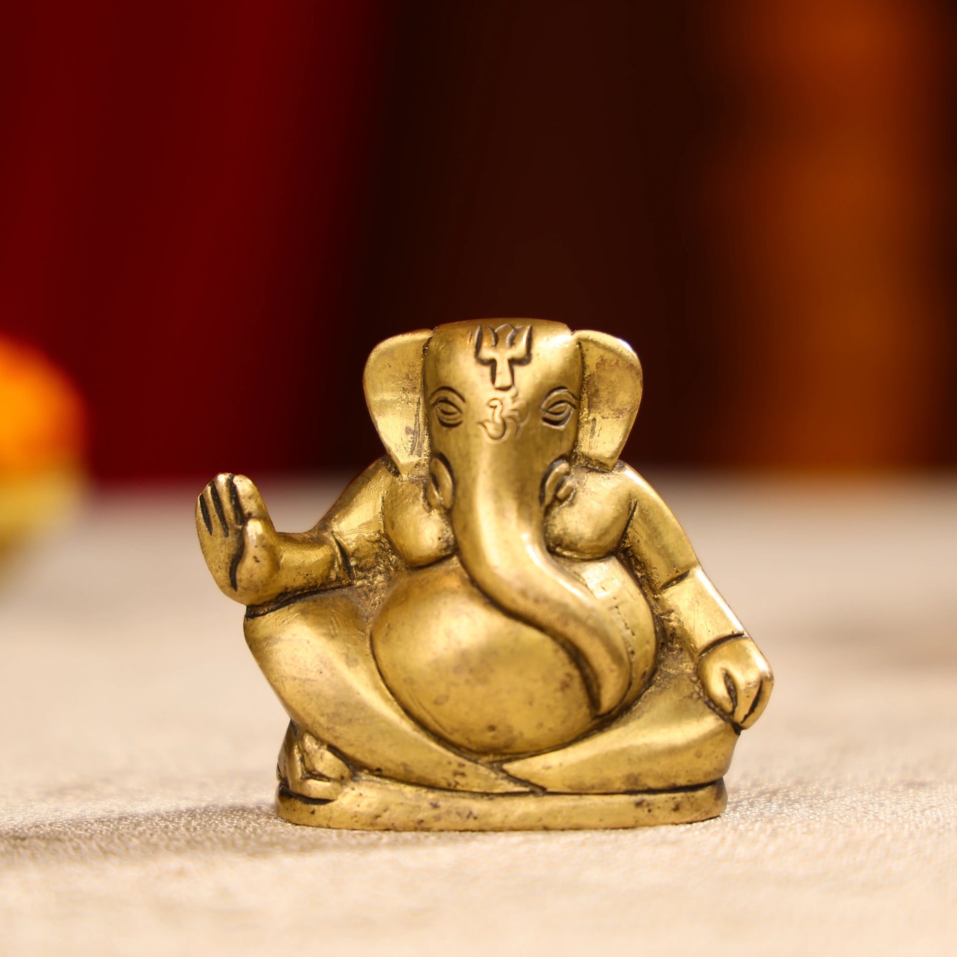 Gold Toned Lord Ganesh Brass Idol In A Sitting Posture