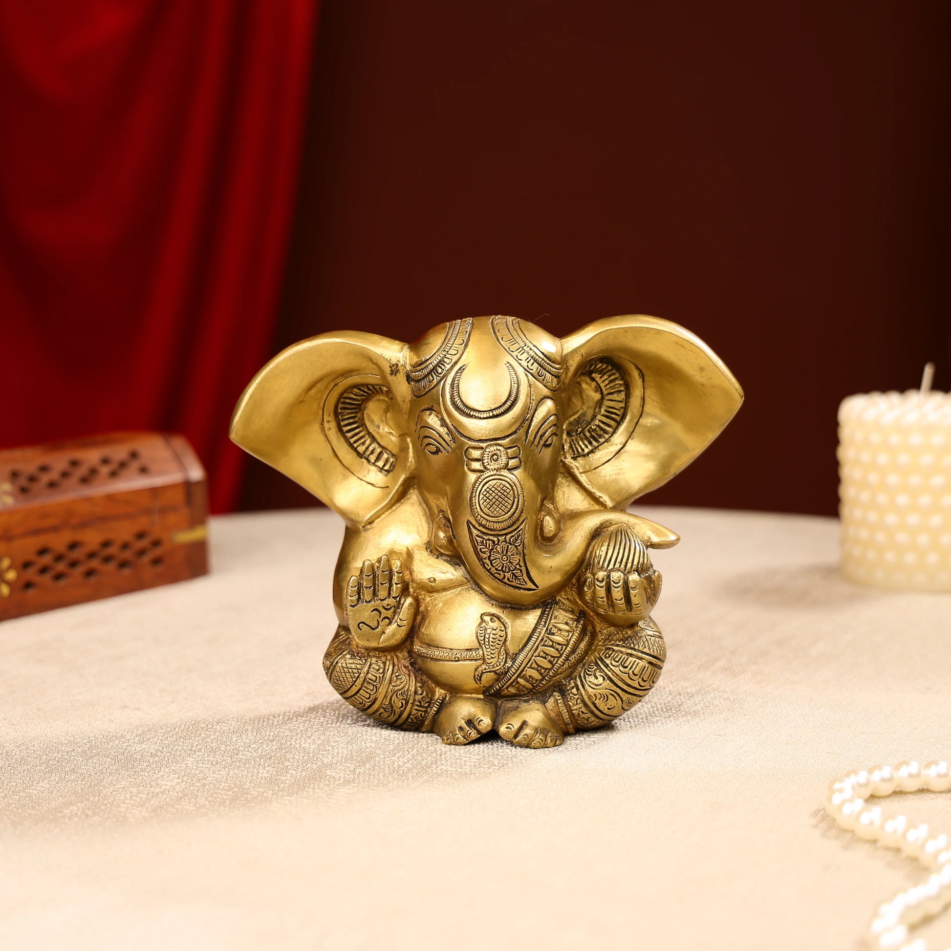 Gold Toned Lord Ganesh Brass Idol In A Sitting Posture