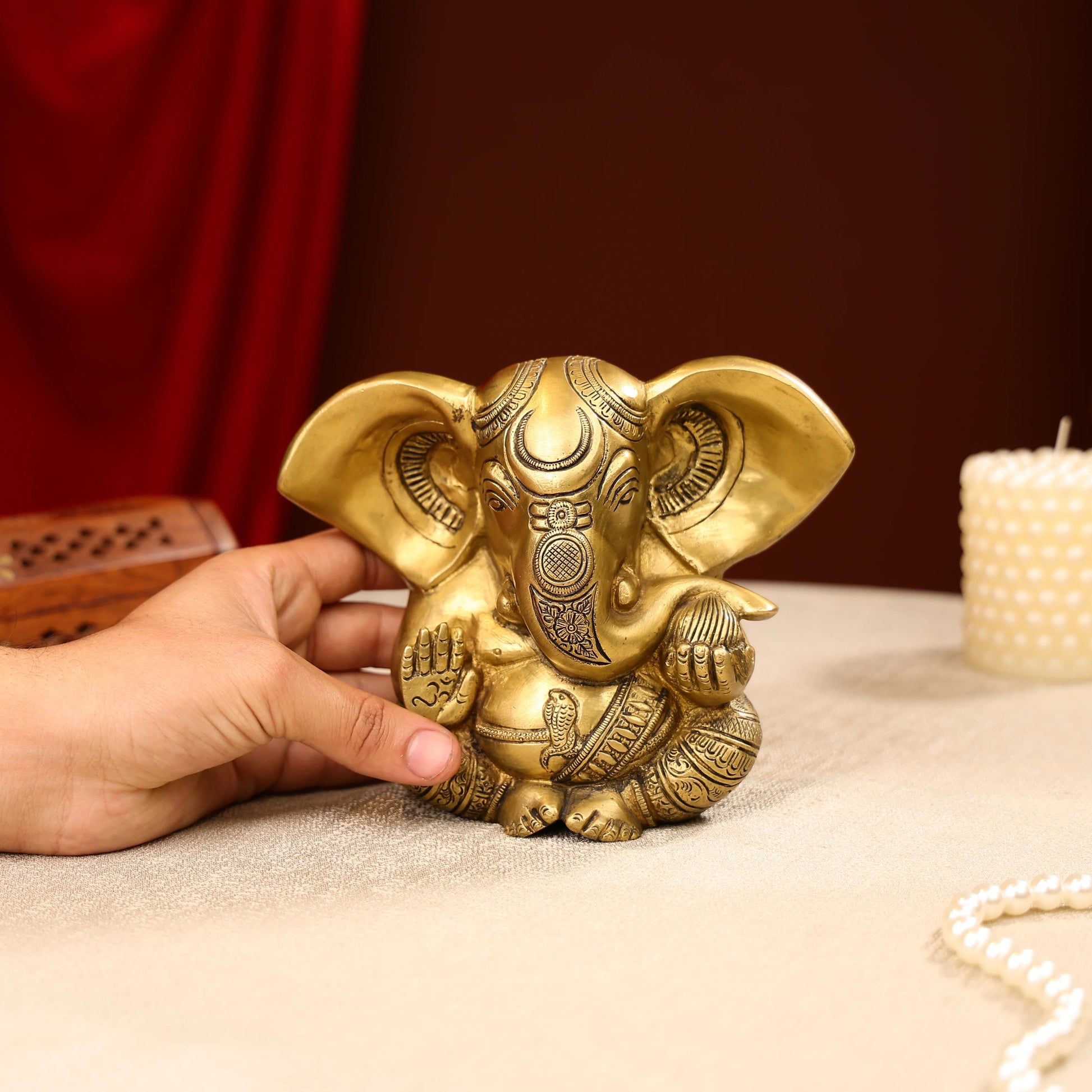Gold Toned Lord Ganesh Brass Idol In A Sitting Posture