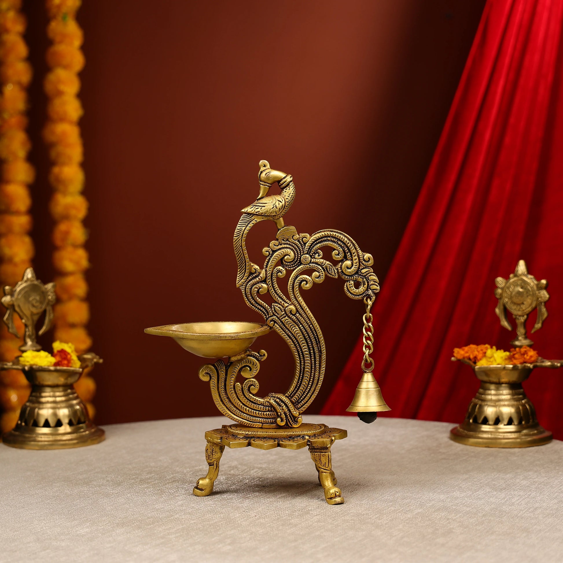 Carved Peacock Design Brass Diya With Bell