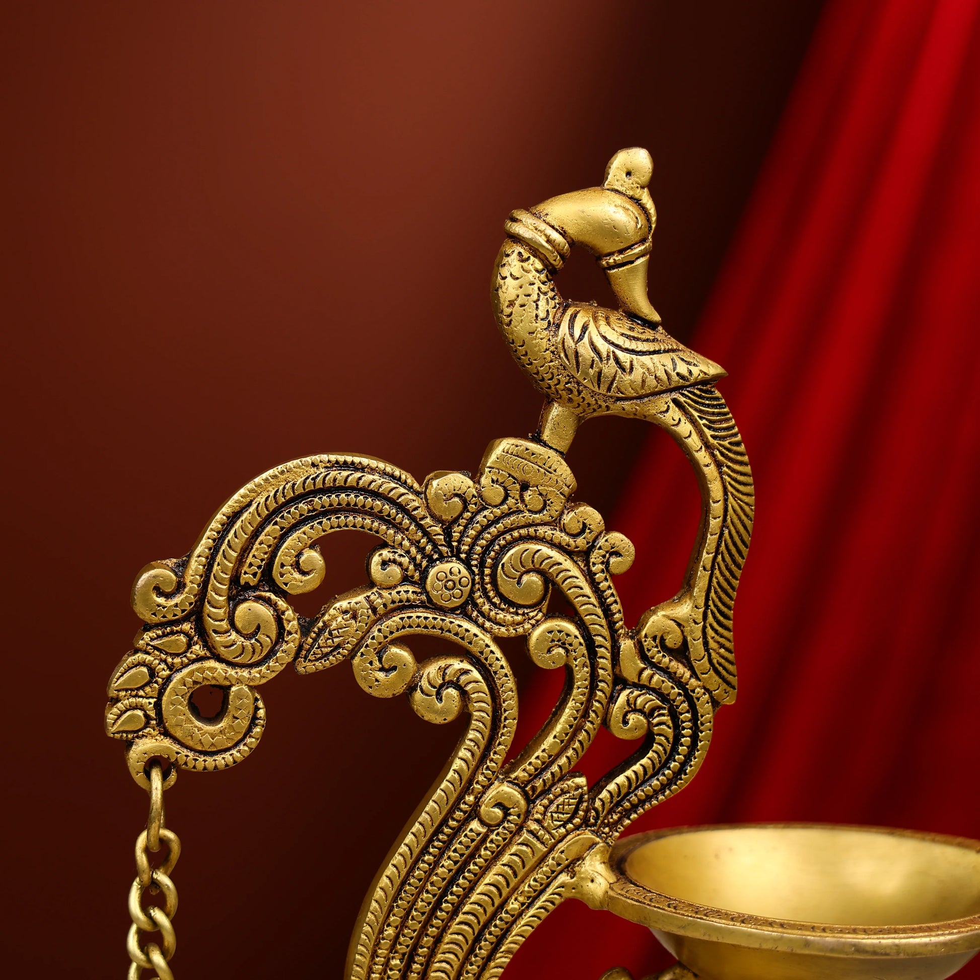 Carved Peacock Design Brass Diya With Bell