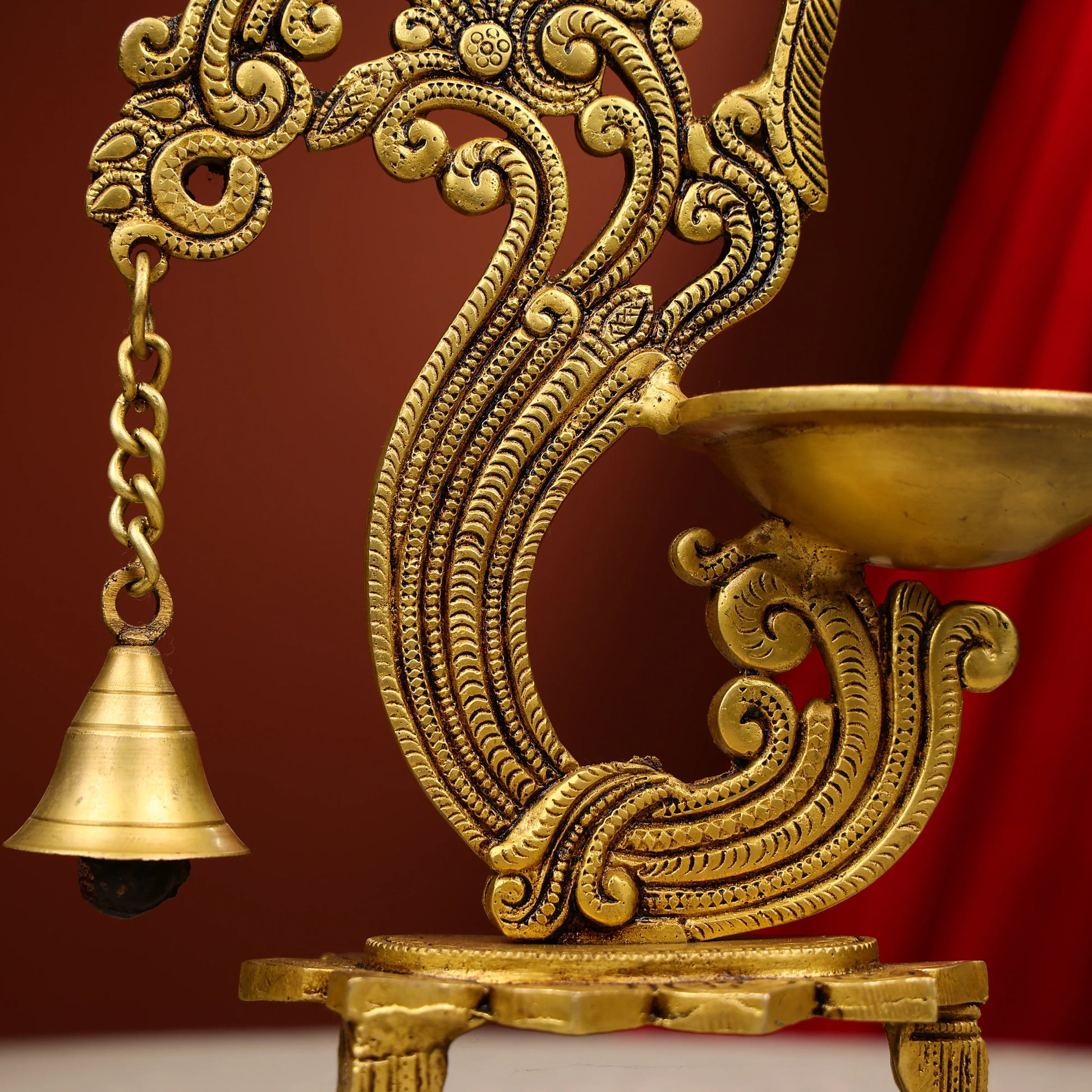 Carved Peacock Design Brass Diya With Bell