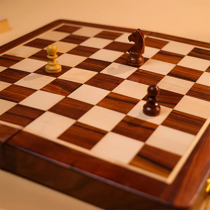 Wooden chessboard with pieces on a checkered pattern
