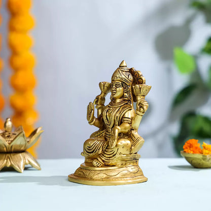 Brass Goddess Lakshmi Sitting On A Pedestal