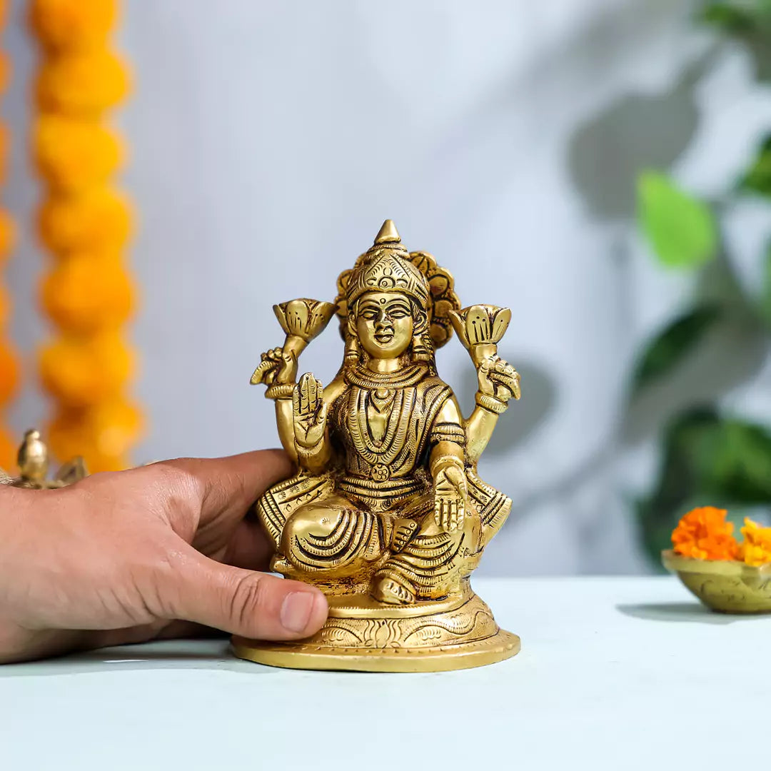 Brass Goddess Lakshmi Sitting On A Pedestal