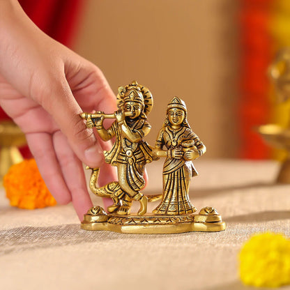 Brass Superfine Radha Krishna Idol On Pedestal With A Peacock Idol