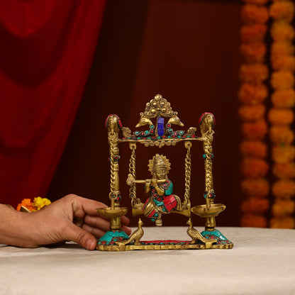 9" Brass Lord Krishna Fluting Idol on Swings With Hanging Panch Diya on Both Sides With Seated Peacocks | Stone Work