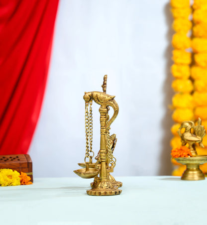 Brass Ganesha Idol On Ornate Jhula With Intricate Detailing