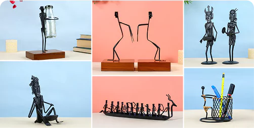 Set of black metal sculptures and desk accessories on a blue background