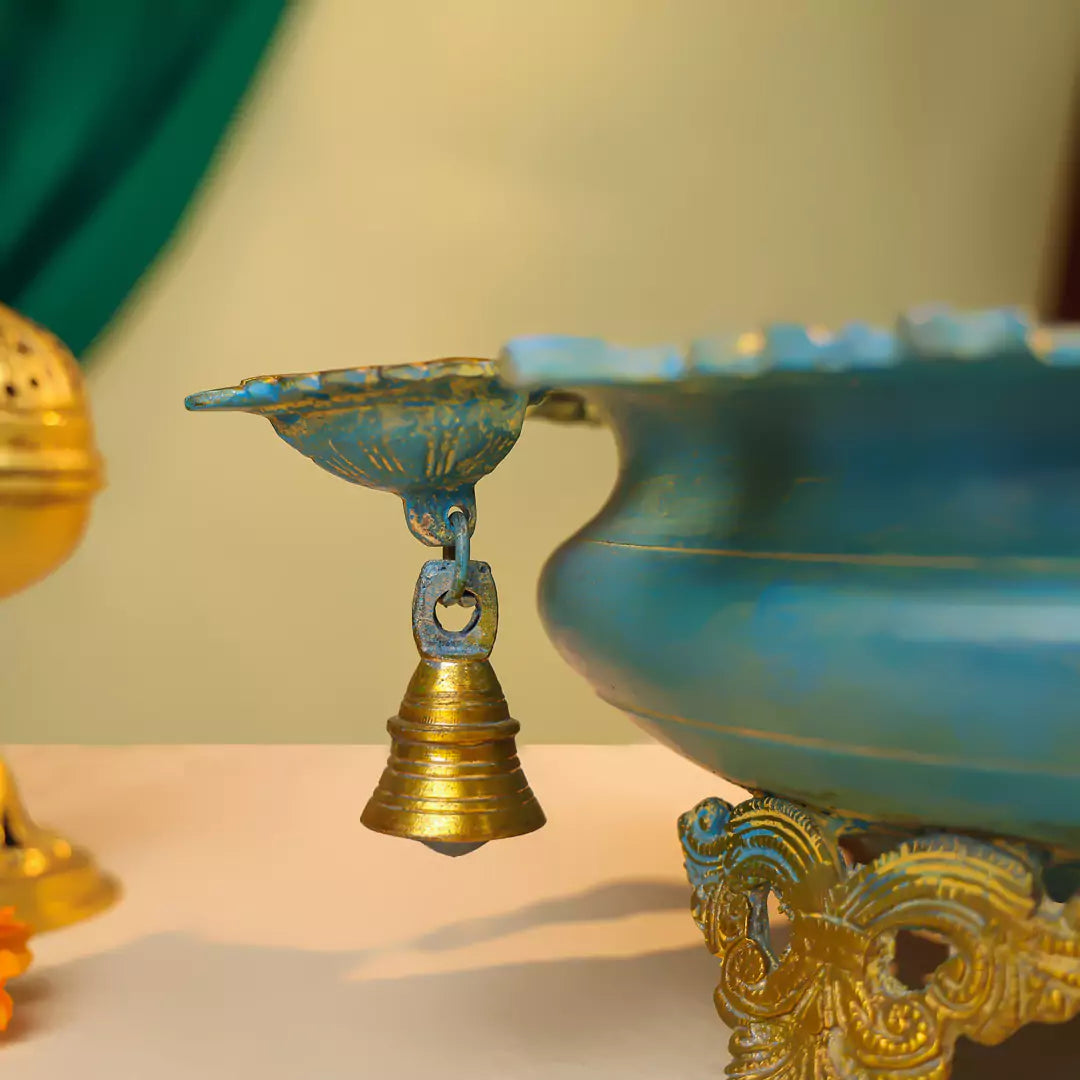 Brass Urli With Diyas On The Edge With Bells