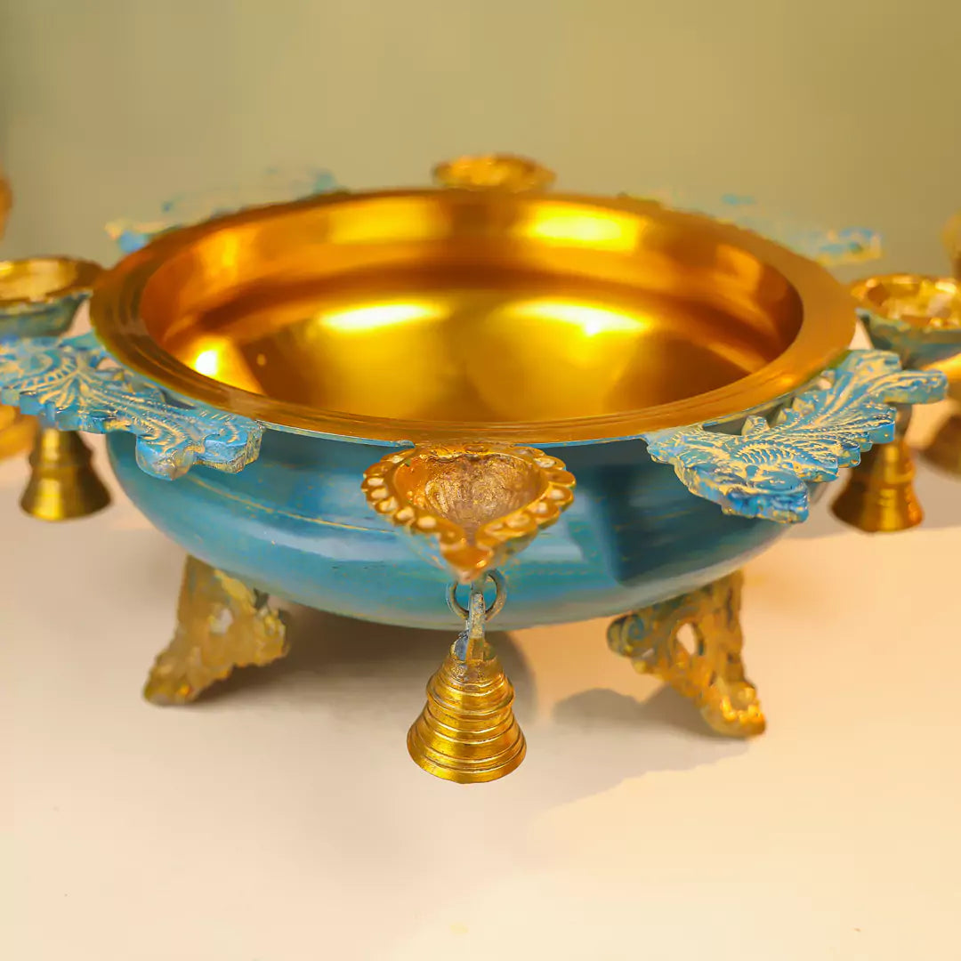 Brass Urli With Diyas On The Edge With Bells