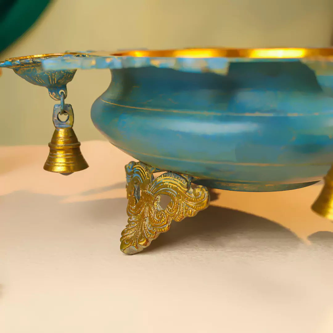 Brass Urli With Diyas On The Edge With Bells