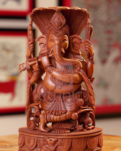 11" Kadam Wood Carved Lord Gnesha Fluting under Seesh Naag